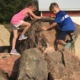 Kids climbing on rocks