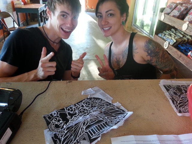 Two people next to map of maze