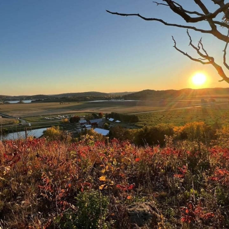 Hill overlooking farm at sunset Hill overlooking farm at sunset